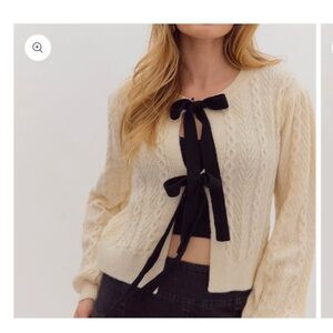NWT cream with black bows cardigan